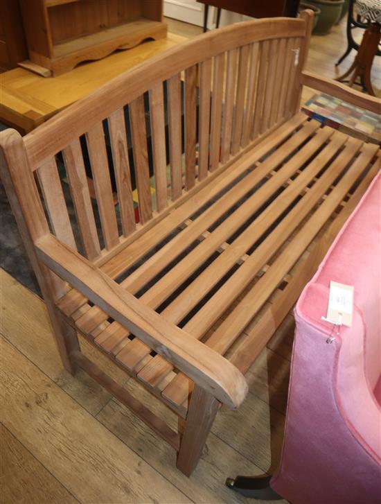 A teak garden bench W.150cm